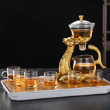 RORA gold deer tea set with dragon-handled glass teapot, six cups and bamboo tray