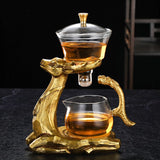 RORA gold deer magnetic tea set with glass brewer and pitcher on a black background