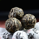 RORA Yunnan Pu'er tea dragon balls in paper wrappers