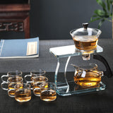 RORA glass tea set with two-tier stand, teapot, pitcher and six cups on a dark mat