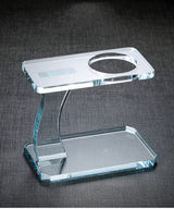 RORA clear glass tea stand with curved support and top platform on a dark grey background