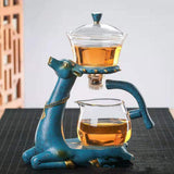 RORA blue deer-shaped magnetic tea set stand with glass brewer and pitcher on a black mat