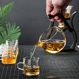 RORA glass teardrop teapot pouring amber tea into a glass cup, black handle